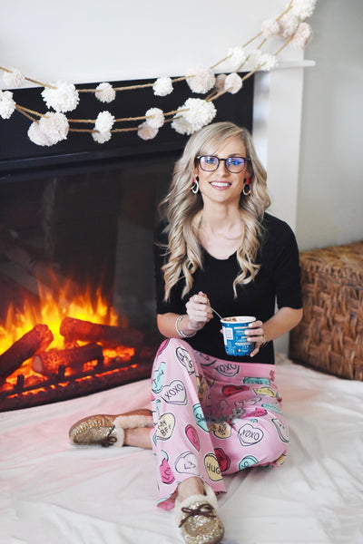 Woman In Pajamas Wearing Umizato Hudson Blue Light Blocking Computer Gaming Glasses Before Sleeping