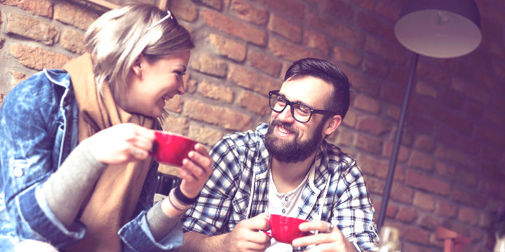 Valentines day date couple man with black prescription glasses drinking coffee