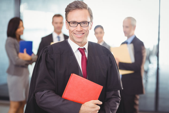 Male lawyer wearing black rectangular prescription glasses frame