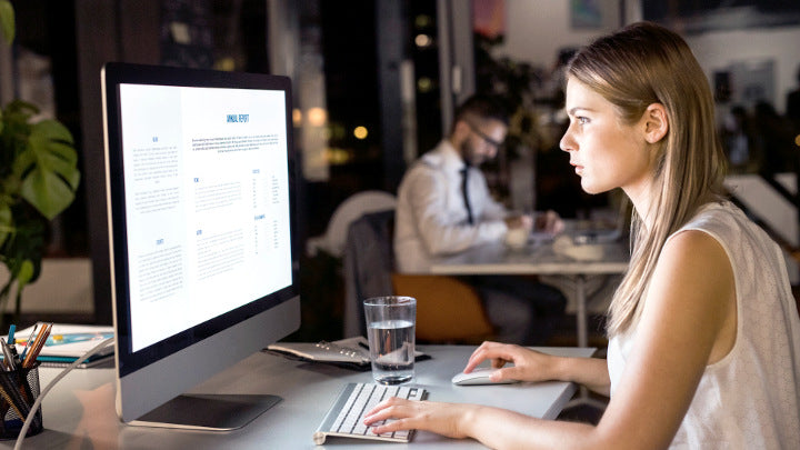 office working lady eye focusing on bright computer screen