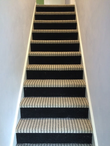 Fully fitted stair carpet designed with Brintons Carpets Bell Twist Ebony 15982 on the riser and Brintons Carpets Stripes Collection Humbug 9ST/38266 on the stair treads