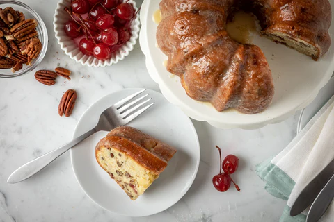 Grey Ghost Bakery German Rum Bundt Cake - Cut Piece on Plate