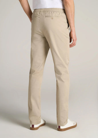 Backside of man standing wearing pull-on twill deck pants