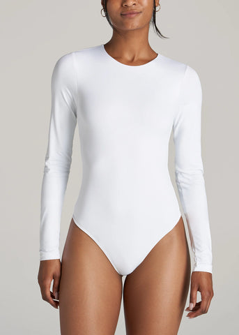 Closeup of woman wearing tall length long sleeve bodysuit in white color