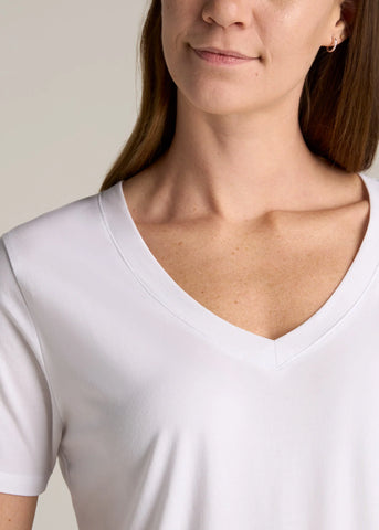 Closeup of woman wearing tall v-neck tee shirt in white color