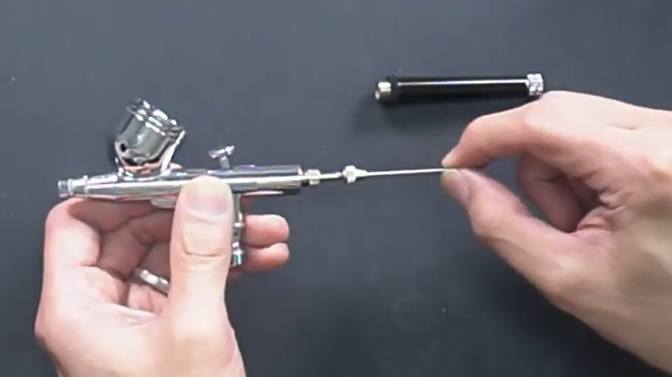 Removing the needle out of an airbrush for maintenance