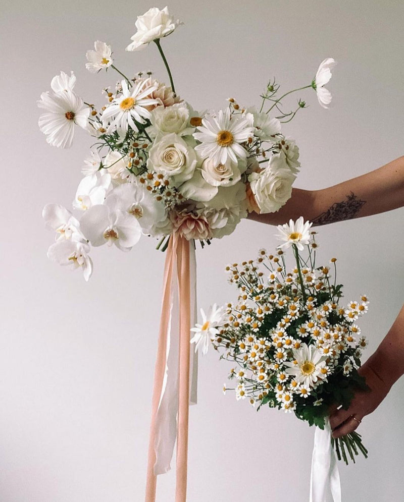 Daisy summer bouquet paired with feathers and stone silk ribbon