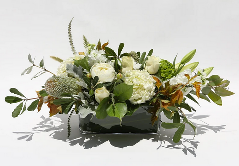 long and low white thanksgiving floral arrangement