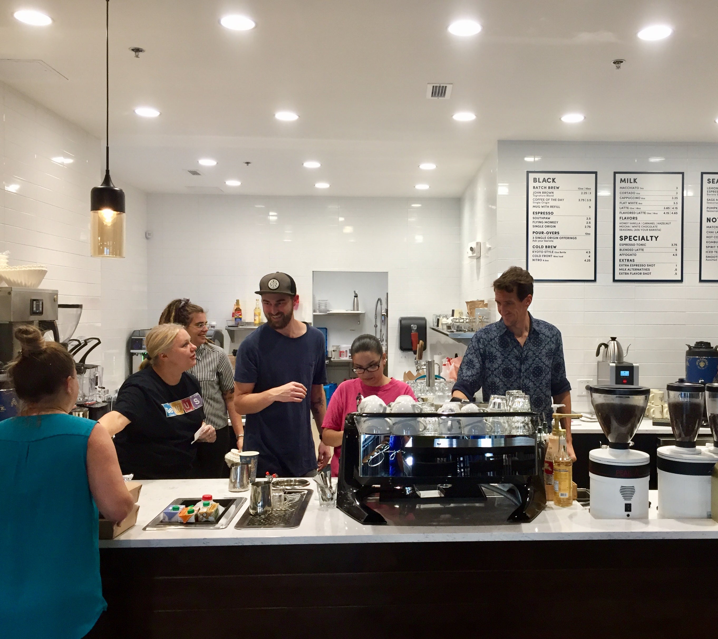 Baristas behind the counter at PT's at Wheatfield Village