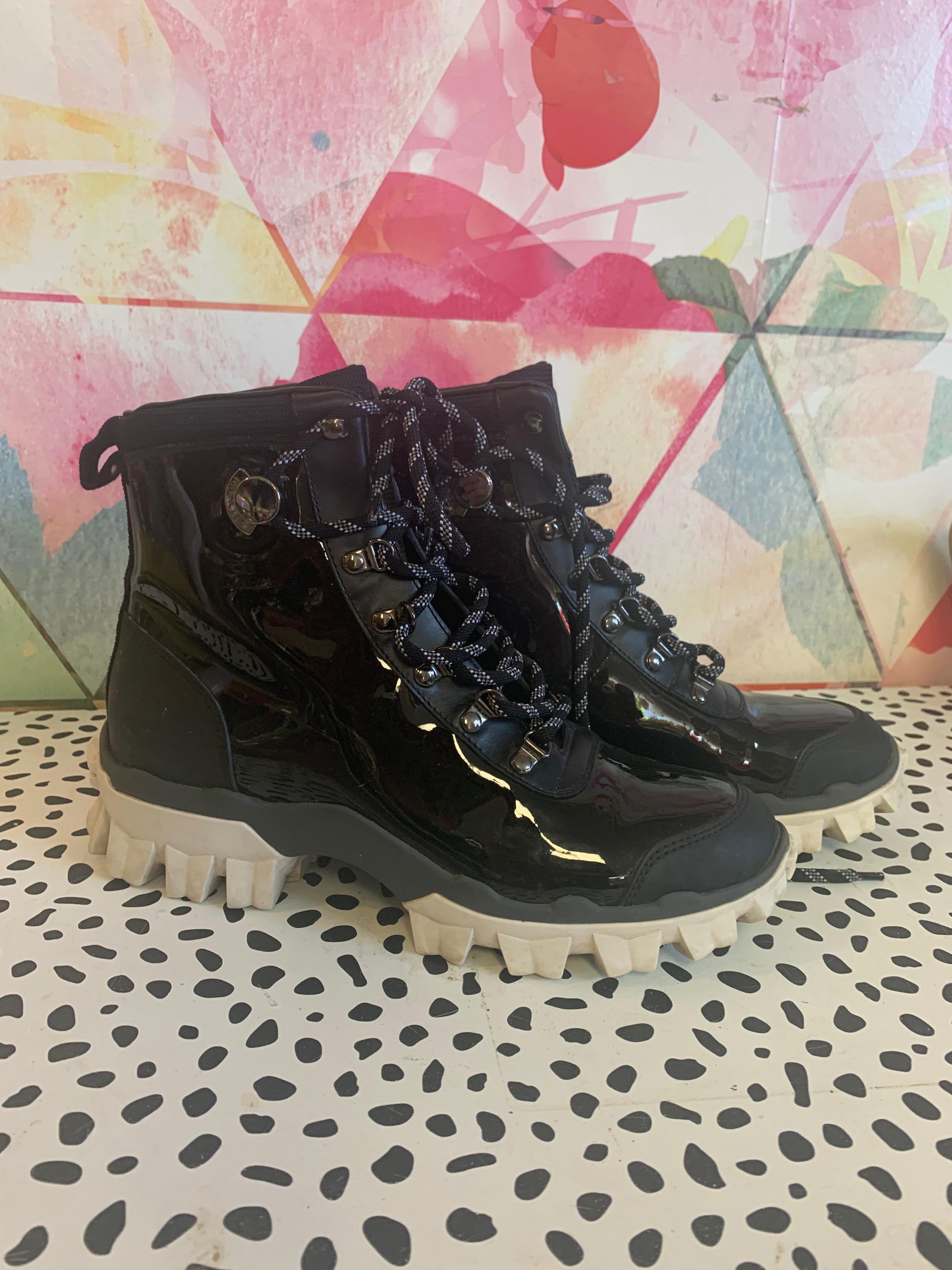 Ler Moncler black lace up boots with white treads. Size 8.5 / 39. Made in Italy.