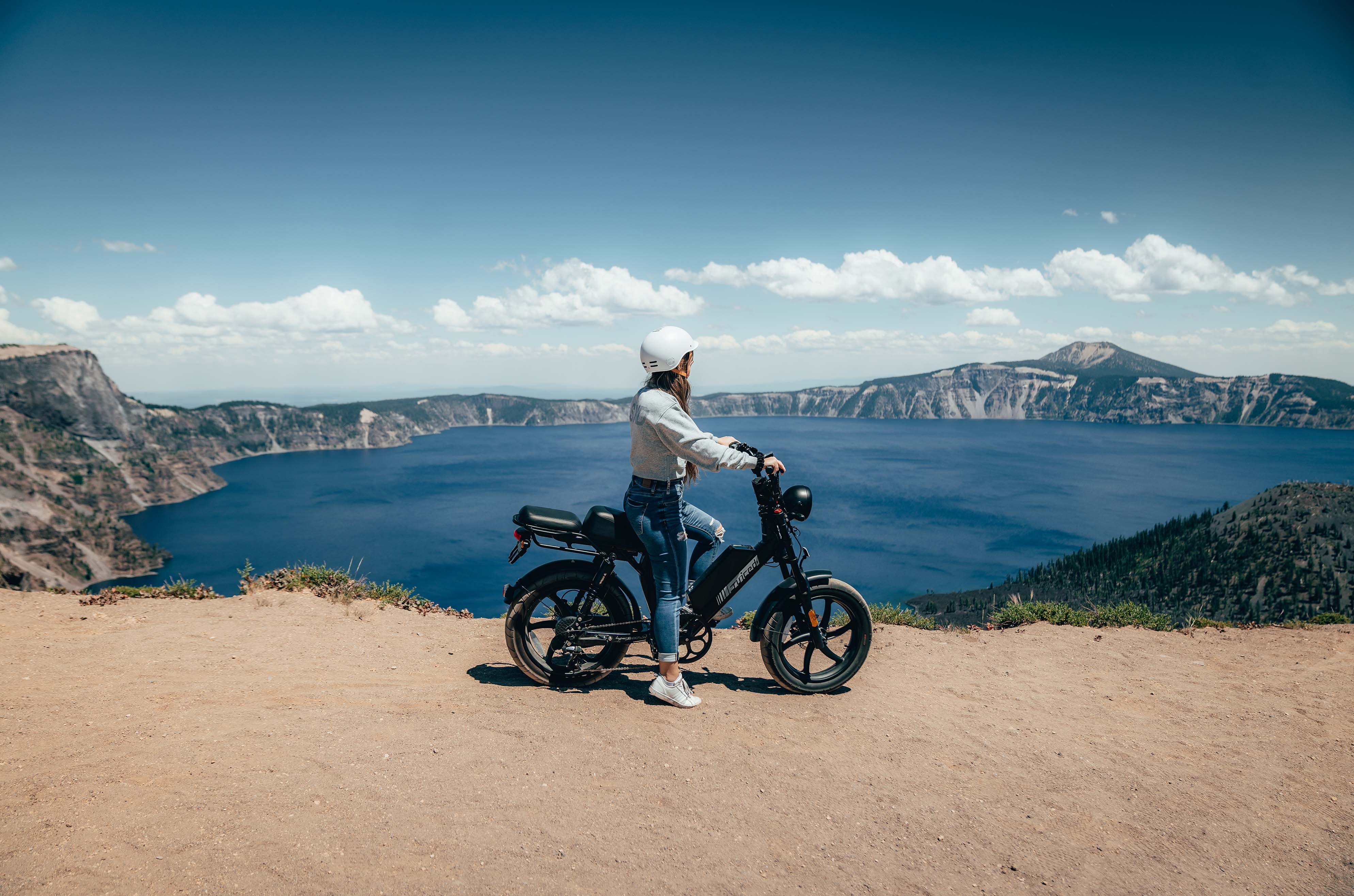 woman sitting on a juiced hyperscorpion next to the seaside