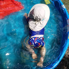Baby wearing reusable swim diaper 