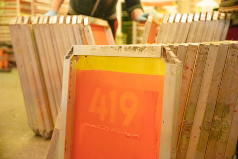 used screen printing screens stacked together