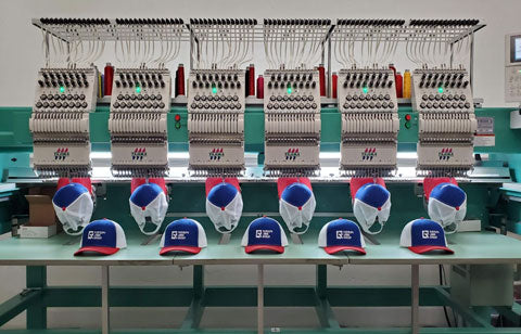 uniformly branded baseball hats