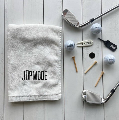 promotional golf items, a towel, tees, golf clubs, ball marker, and golf balls, provide by jupmode