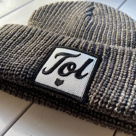 beanie with a patch on it with a scrip tol font and the shape of the state of ohio underneath