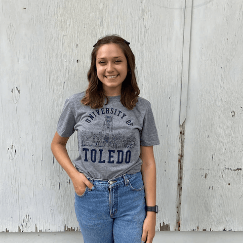 woman dressed in UT vintage shirt and denim jeans