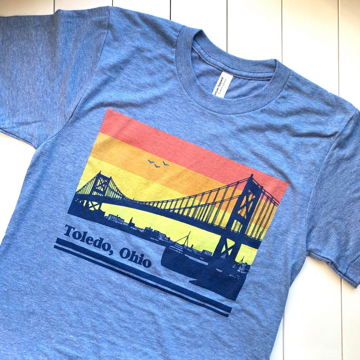 https://cdn.shopify.com/s/files/1/1010/8058/t/17/assets/pf-445db771--toledo-high-level-bridge-shirt_1200x.jpg?v=1603399735