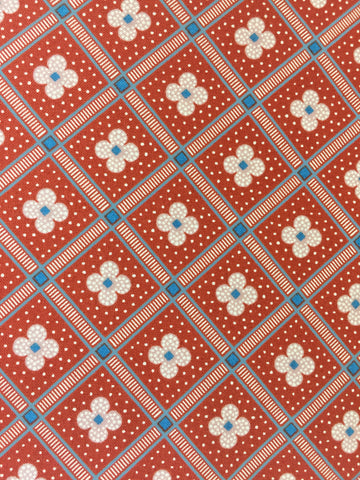 Liberty 'Manor Tiles' fabric. A 100% cotton fabric in quilting weight. This Liberty 'Manor Tiles' fabric from The Summer House collection features a elegant floral tile pattern on a bold red background. Not just for quilting, this fabric is also suitable for dressmaking and home decor. sold by UK Liberty of London fabric stockist Frills and Froth. seller of designer fabric from Liberty, Michael Miller and Riley Blake