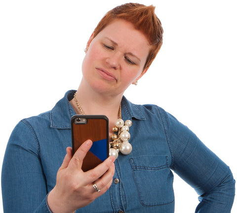 woman looking at boyfriend's phone for cheating