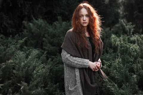 Woman outdoors in fir trees