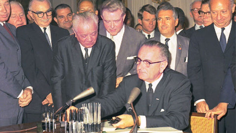 Lyndon B. Johnson signs civil rights act of 1964