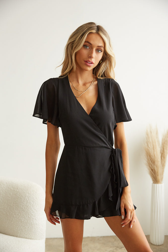 Front view of black side tie romper