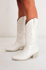 what to wear to nashville - nashville bachelorette outfits - white bridal cowgirl boots