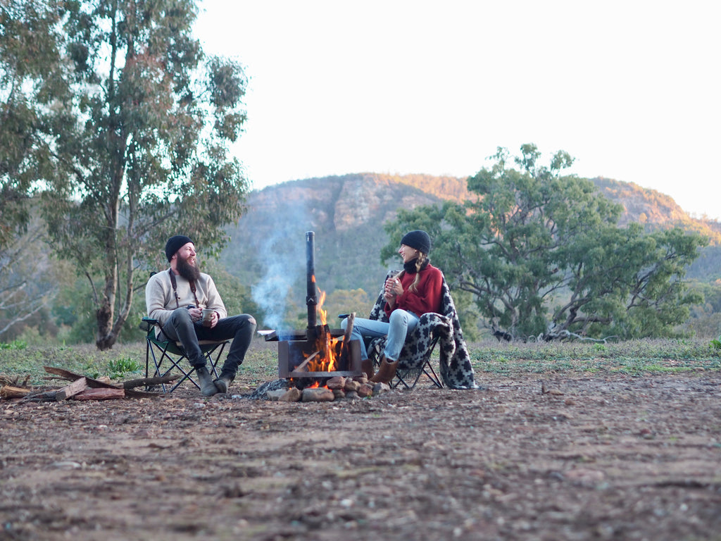 People camping by a fire