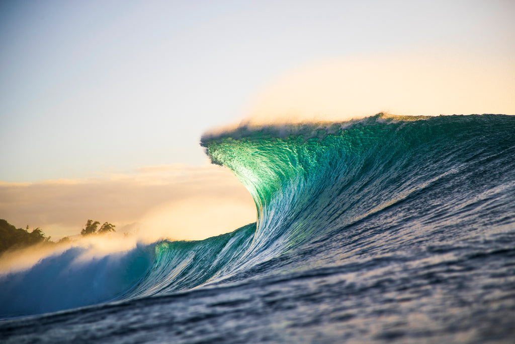 an empty wave during the golden hour at pipeline by brent bielmann