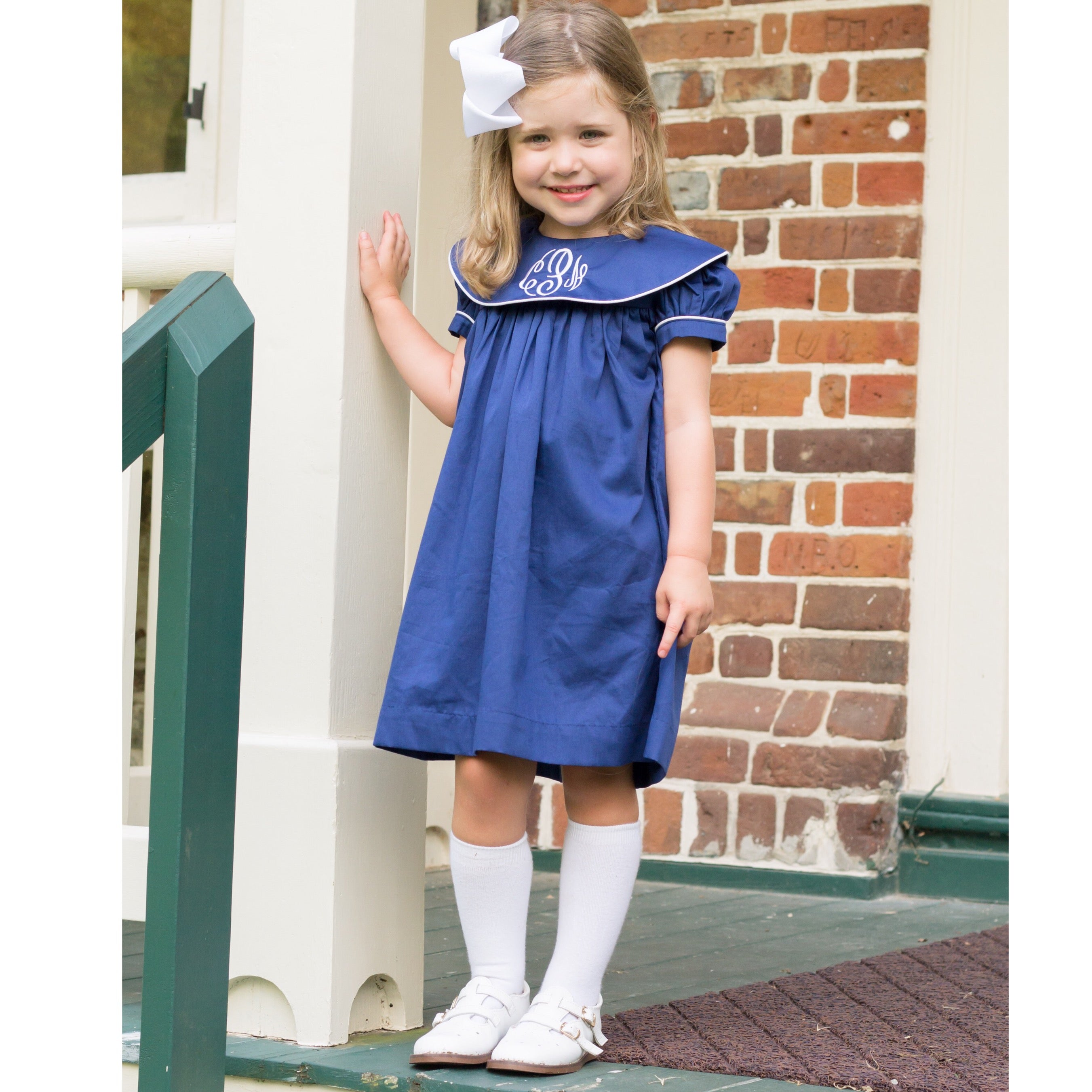 navy blue dress with white piping