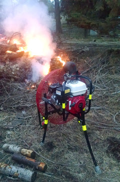 Fan running at neutral, on uneven ground, aimed at the brush pile (facing left)