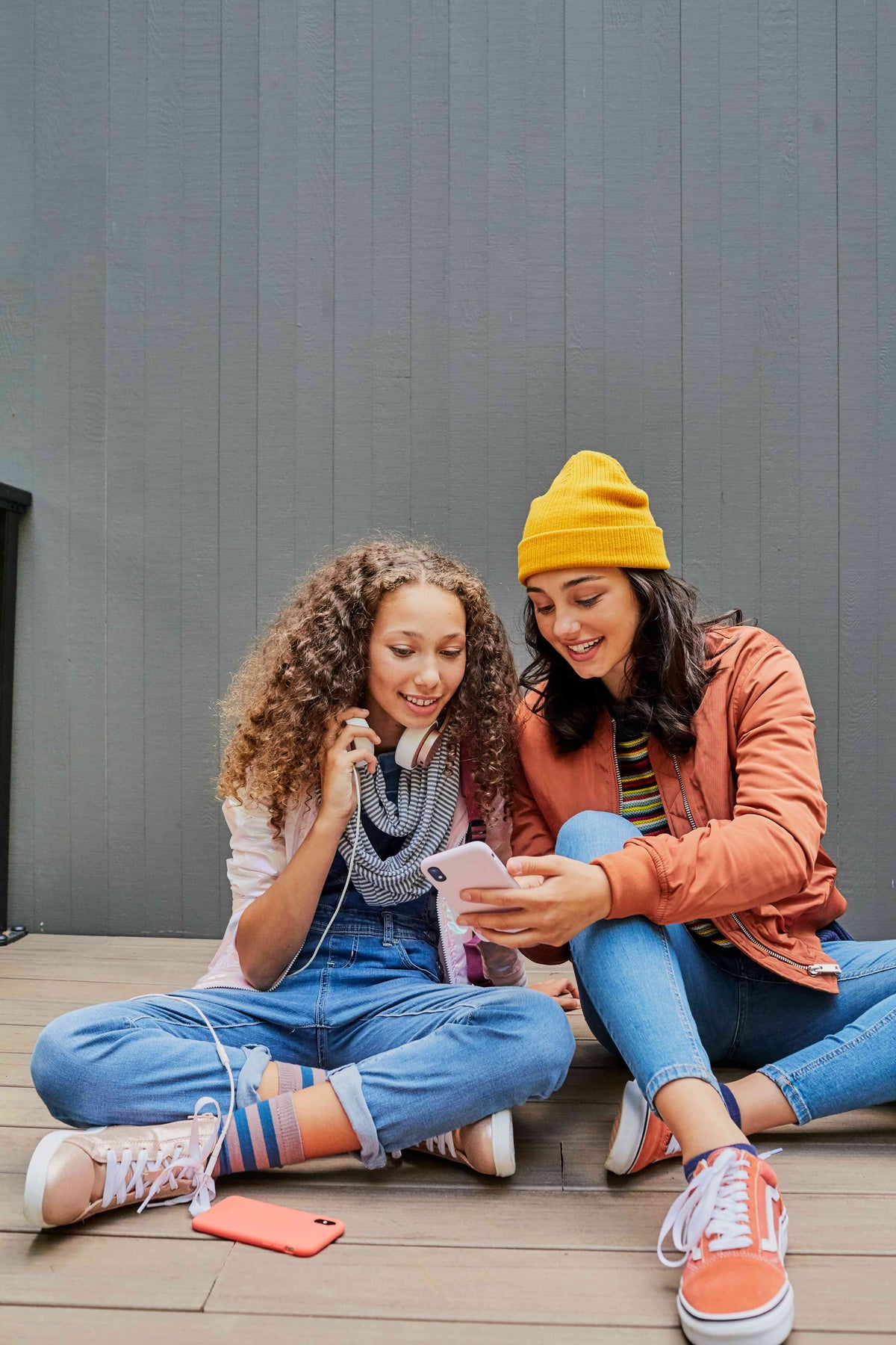 Two teen girls using a cellphone