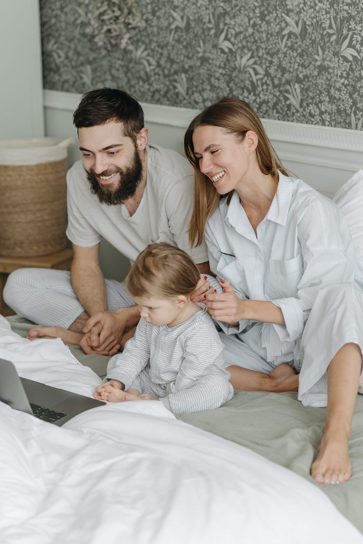 Parents and child watching on a computer