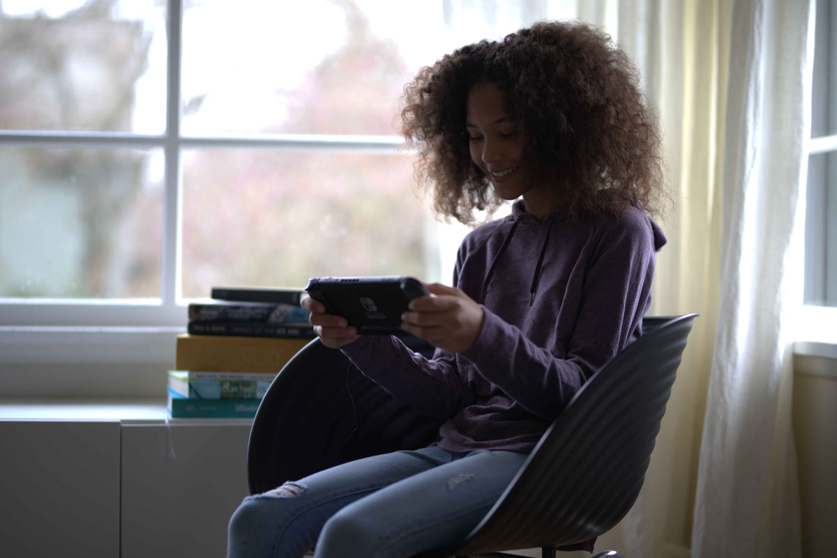 Teen playing on a Nintendo Switch