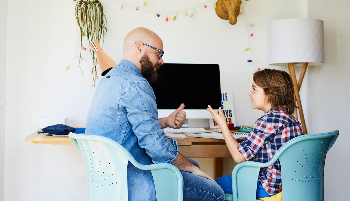 Father and child in front of computer