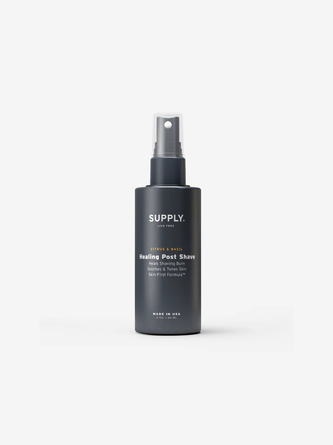 Bottle of Supply Healing Post Shave spray with citrus and basil.