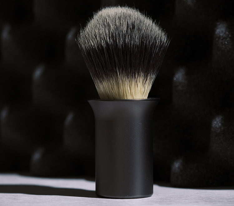 Shaving brush on black background