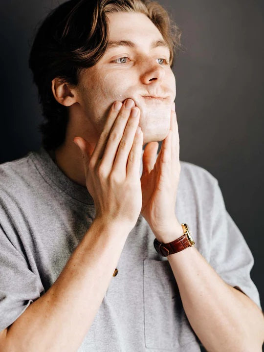 Man washing his face