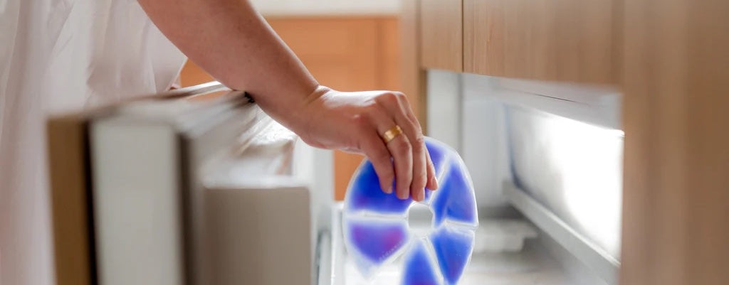 woman putting cooling pad in fridge