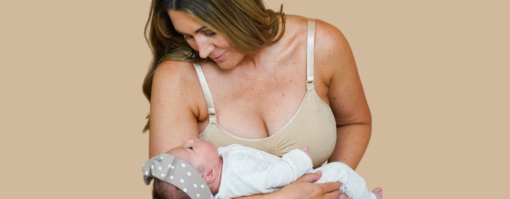 mum holding baby and wearing a breathable nursing bra