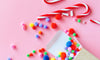 Candy Cane and pom poms for Christmas Candy Cane Favor Bags
