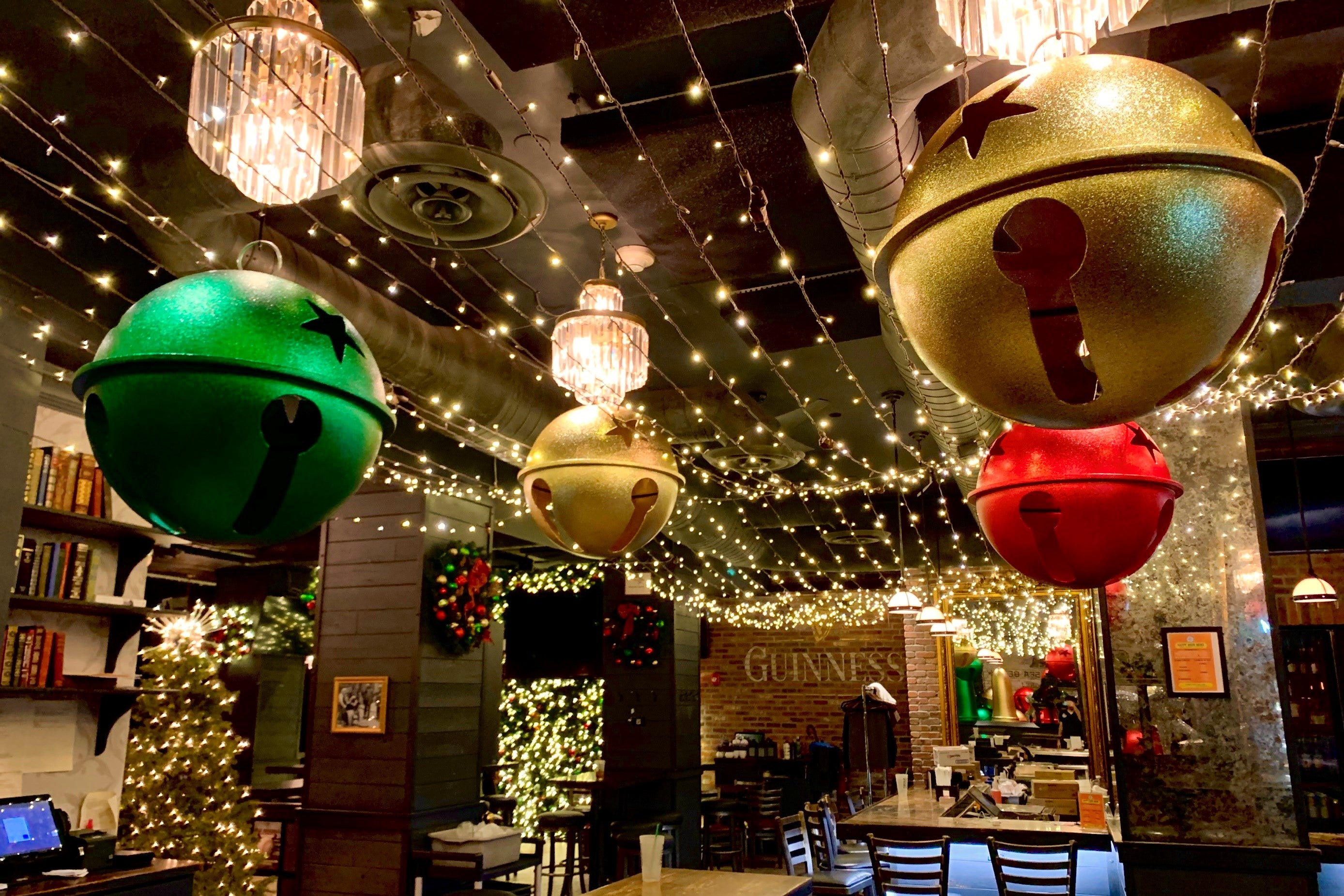 The Chelsea Bell - NYC Top Holiday Restuarant - Christmas Decorations - Bells and holiday lights Hanging above tables