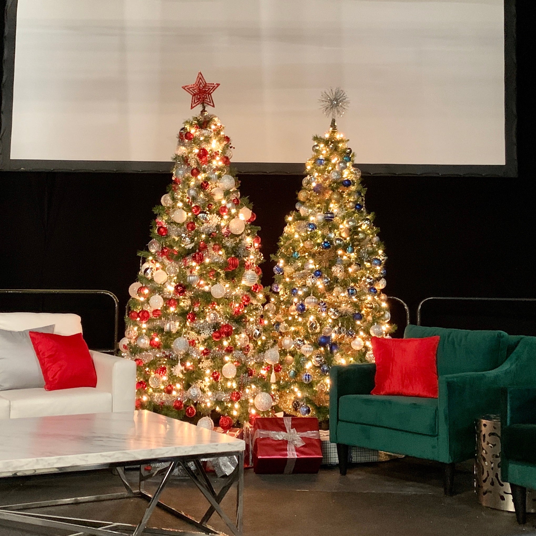 Decorated tree cluster on stage at commercial event