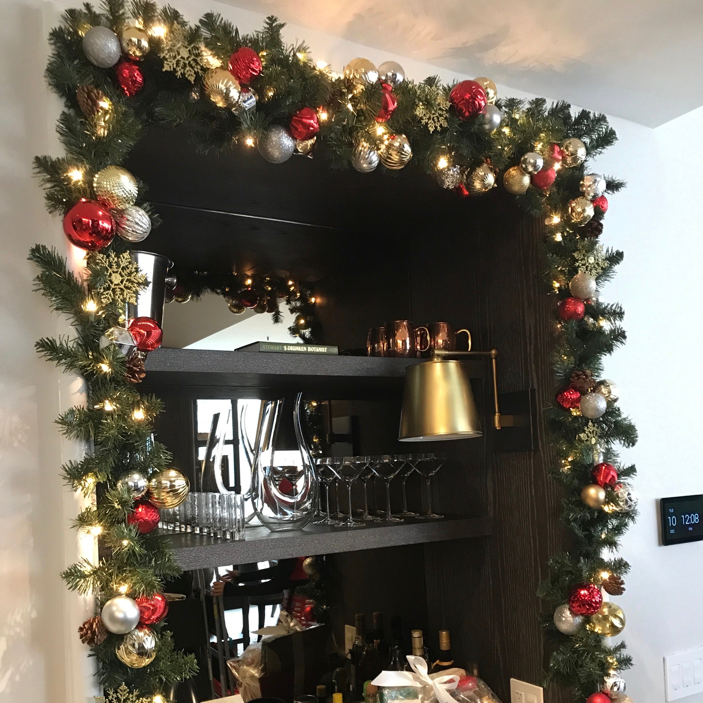 Decorated artificial Christmas garland on furniture in residential room