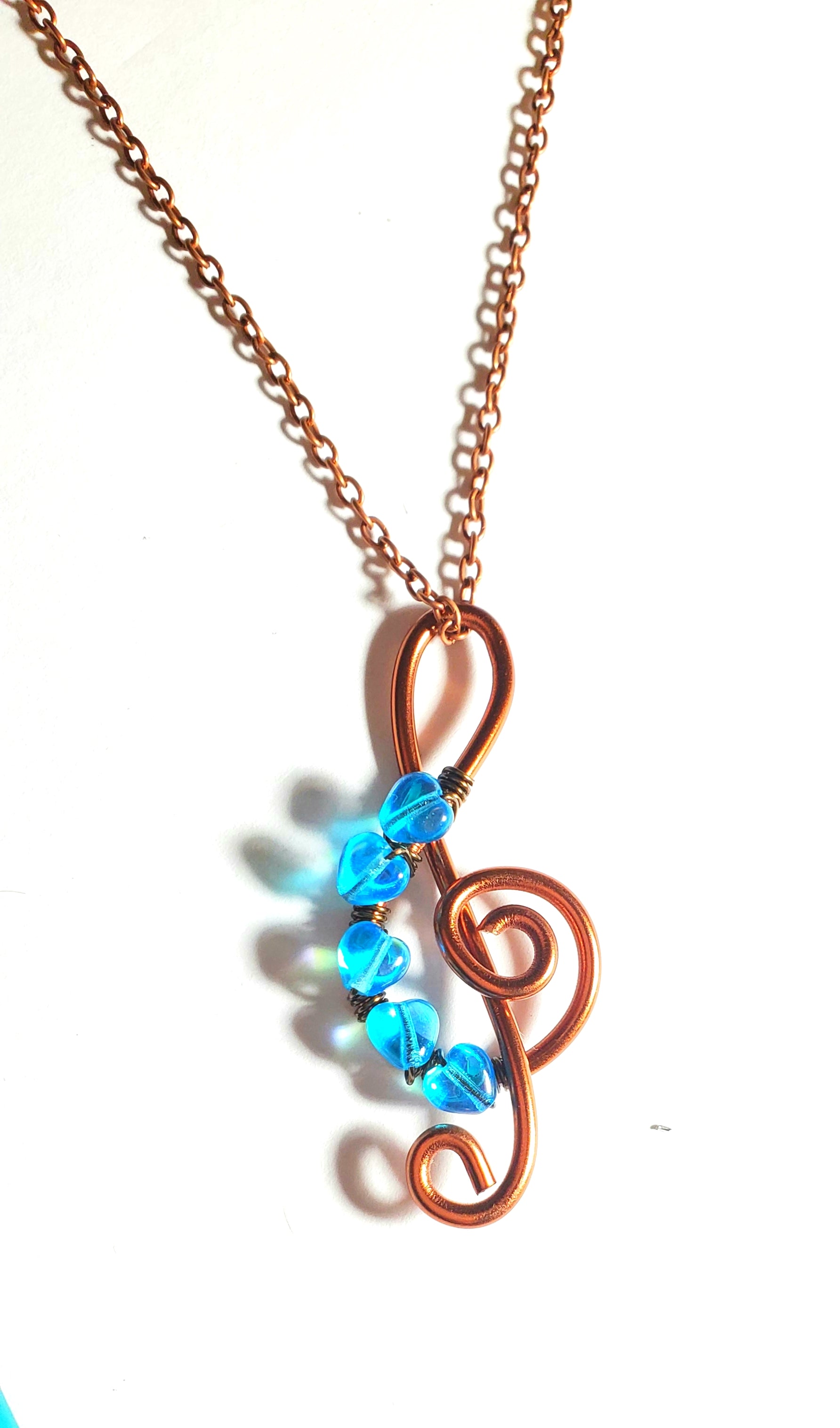 I Love the Blues Treble Cleft Blue Heart Pendant Necklace, Five Tiny Aqua Blue Glass Hearts and an Antique Copper Treble Cleft Pendant on chain