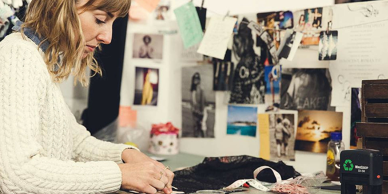 Ellie Simpson-Gray of Iris London sewing in her studio