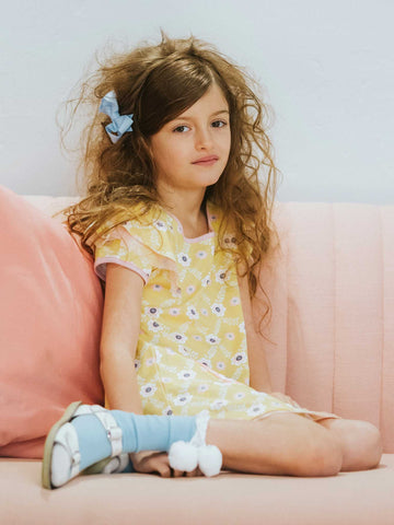 Girl in a yellow flower dress