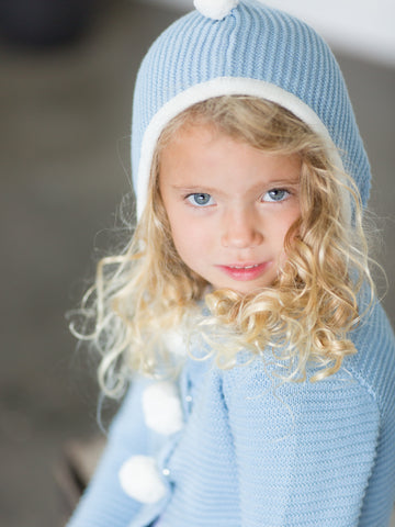 Girl in blue cardigan