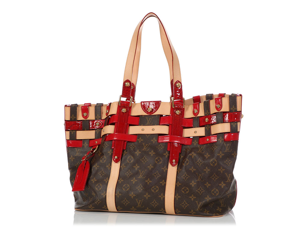 Sold at Auction: LOUIS VUITTON VINYL LOGO TOTE BAG. LEATHER TRIMME